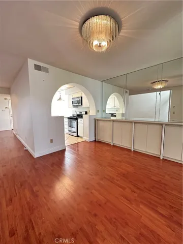 Second dining area off kitchen and living rooms, added custom cabinets for ample storage space