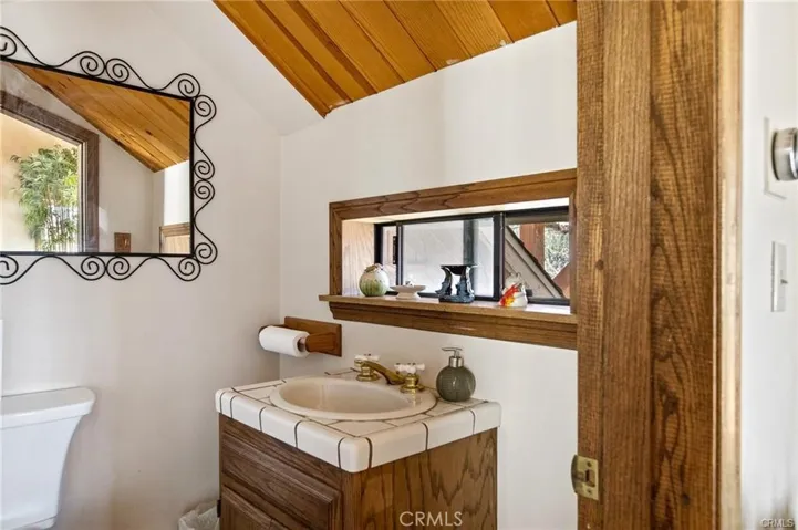 Half bath off of living room.