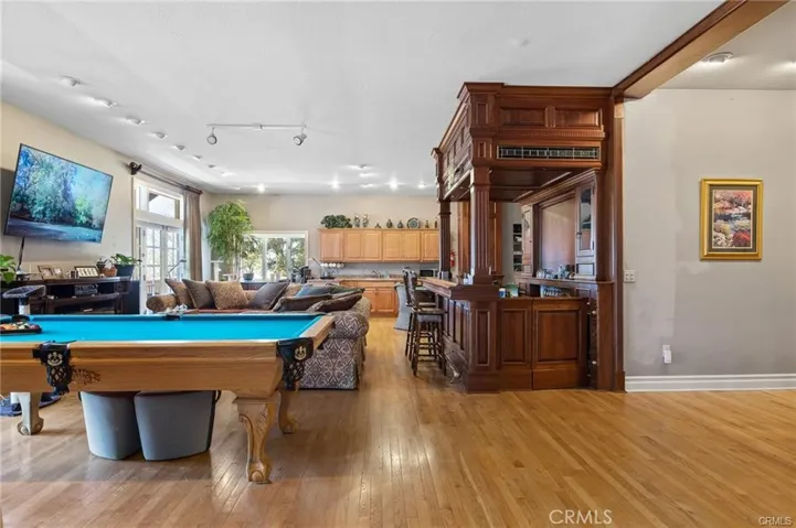 Studio apartment shown living room open to kitchen