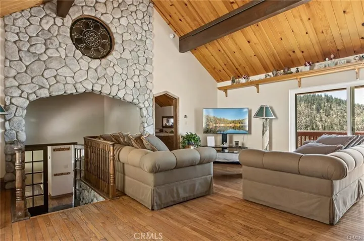 Living room with stone wall and stain glass.