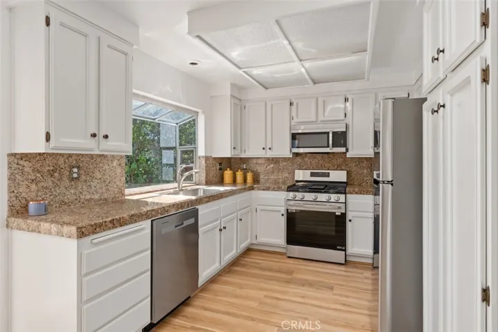 Kitchen Overlooks Family Room and Garden