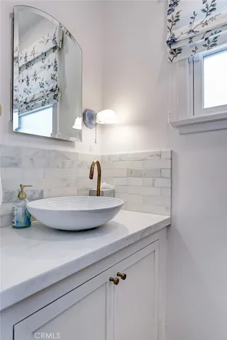 Beautifully remodeled 1/2 bath with marble countertop