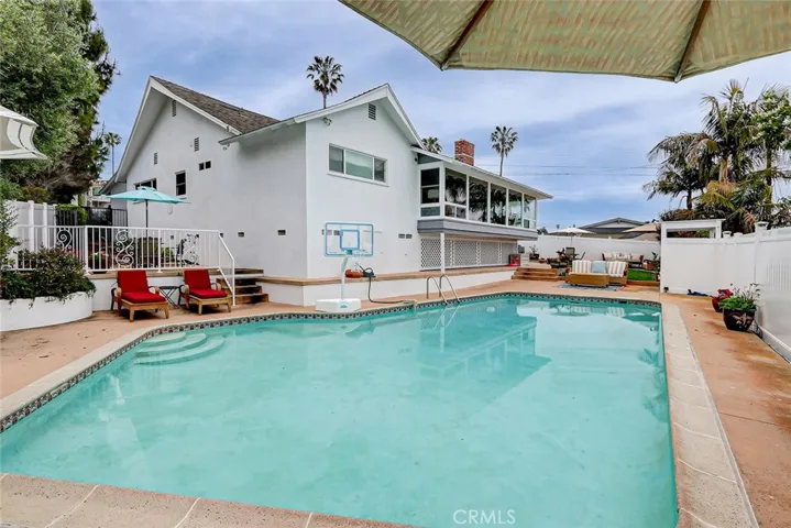 Large pool with several lounging areas