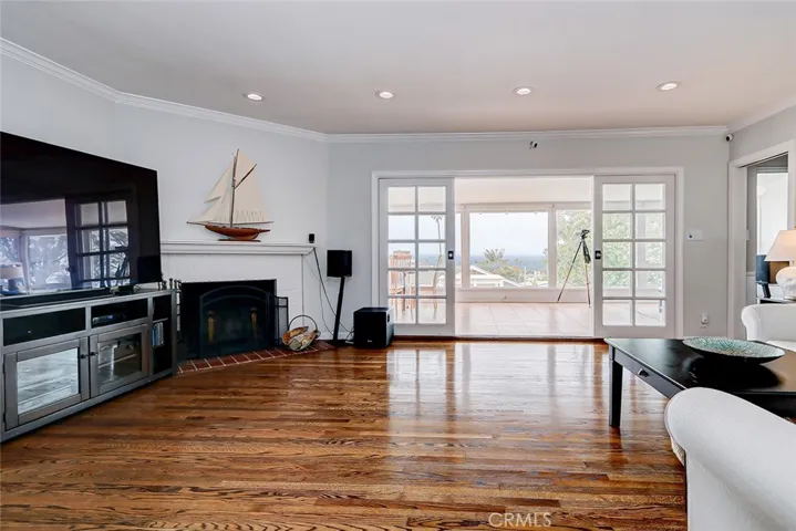 View of Living Room facing sunroom and view from front door perspective