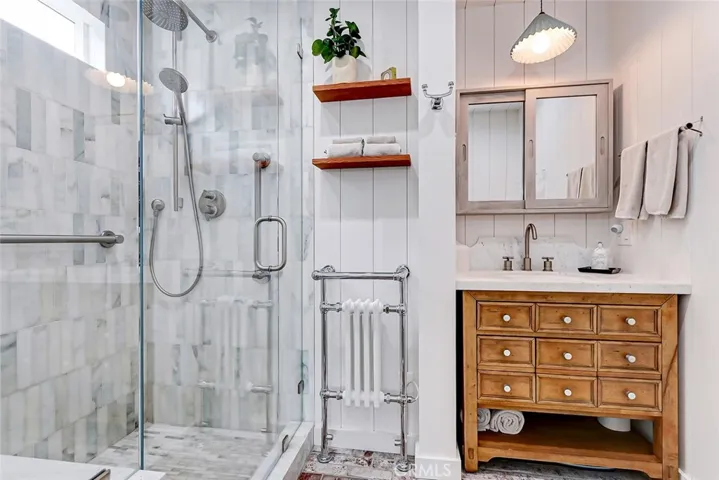 Recently renovated master bathroom with towel warmer