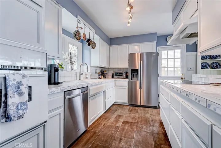 Kitchen with door leading to backyard