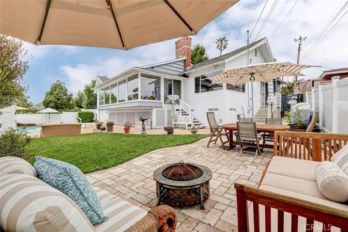 Large paver patio has space for outdoor seating and eating area