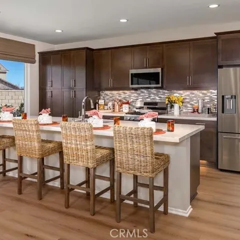 Photo shown of Model Home kitchen. Not home-site #575