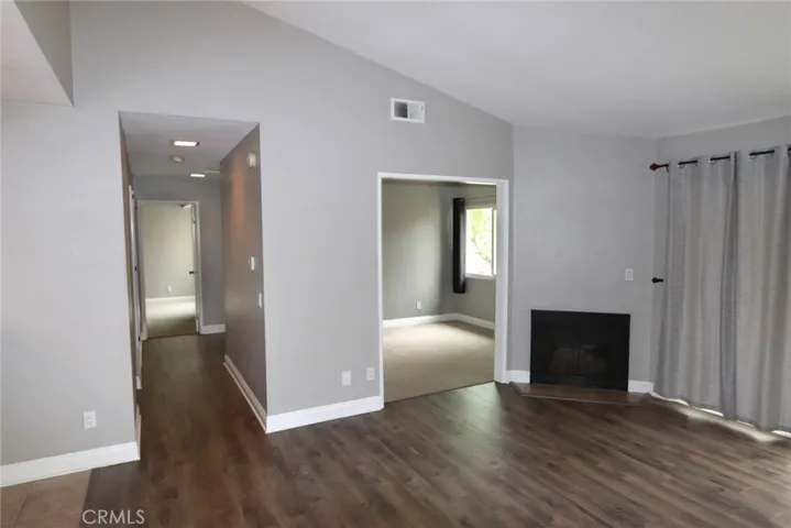 Looking down the hall and into bedroom