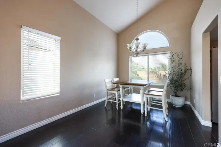 Take in the beauty of the backyard with a bird feeder and views while dining