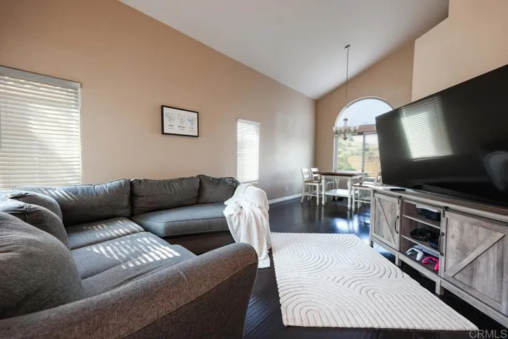 Family Room with Vaulted Ceilings; view from Family Room to the Dining Room
