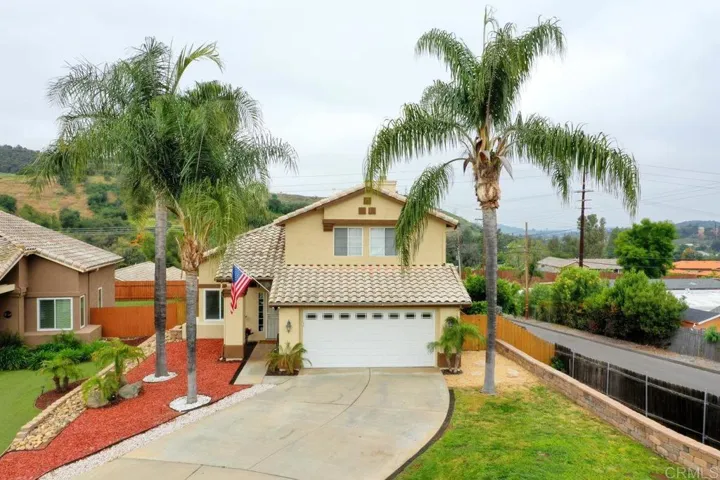 Beautiful - showing off natural grass on the right and dry landscaping to the left of the entryway