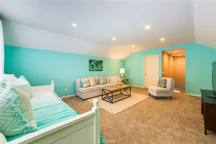 Another Angle of the BONUS ROOM. There's a huge storage room behind the white door.