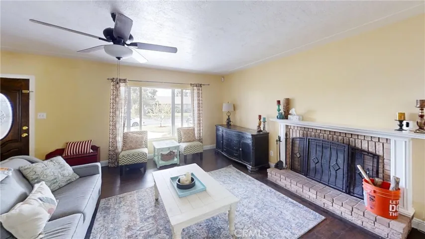Entry and living room, with wood burning fireplace