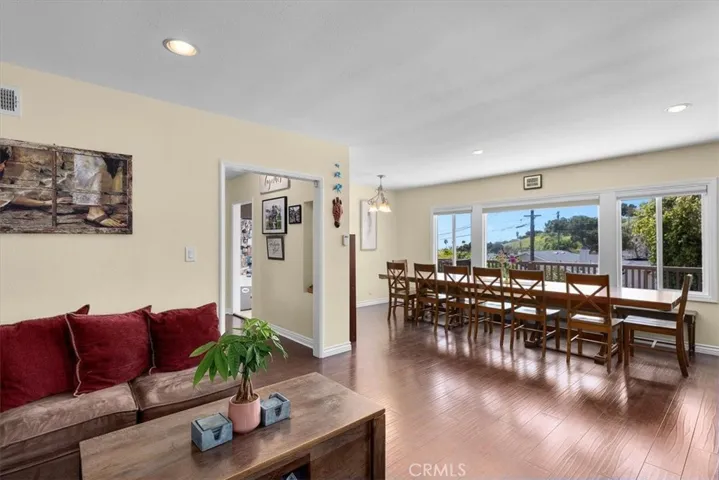dining room with peek-a-boo Ocean views and view of the lush yard