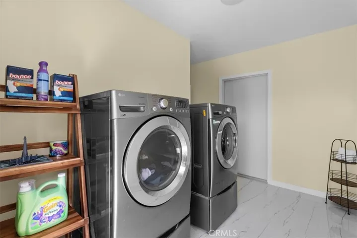 Large laundry room on main floor with access  to garage and backyard