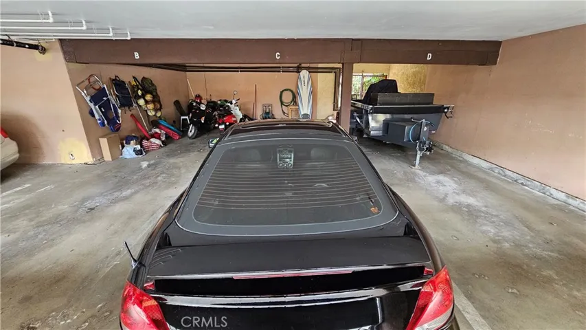 Covered parking area off alley