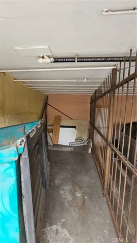 Covered parking area off alley