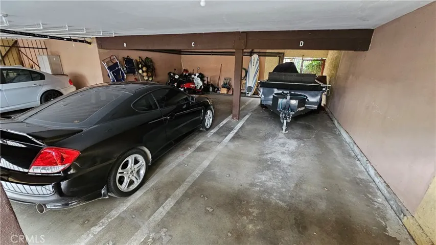 Covered parking area off alley