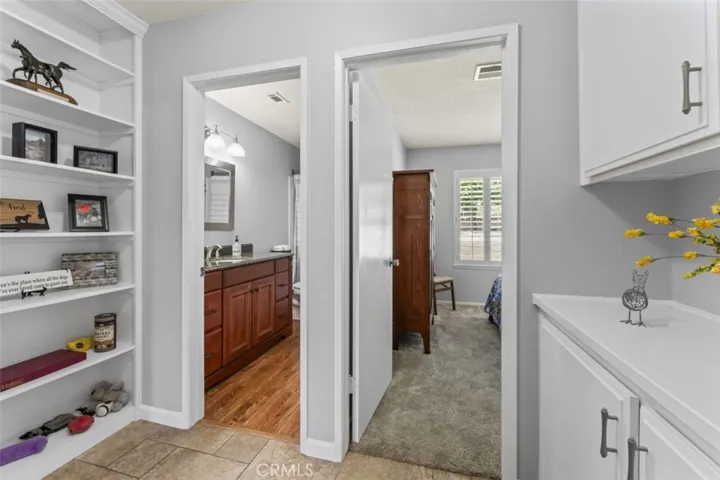 Hallway w/ Built-In Shelving and Cabinetry