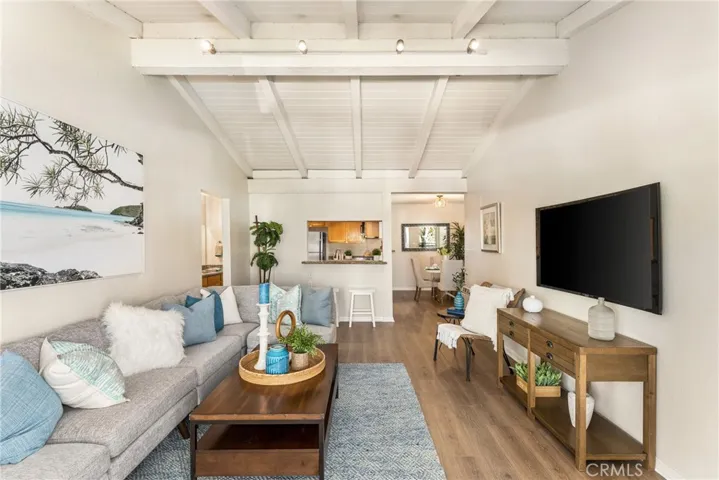 Living Room. New paint, New floors, Vaulted ceilings. Open to both kitchen and dining room