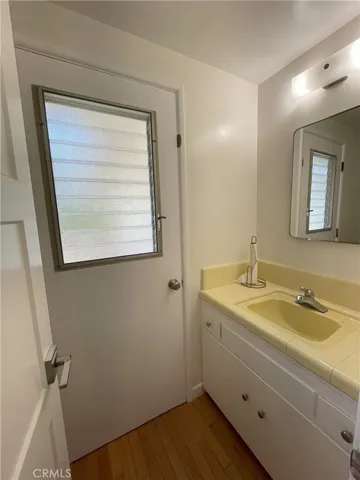 Bathroom off laundry room and kitchen