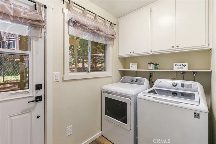Laundry Room Off Kitchen Leads to Back Deck