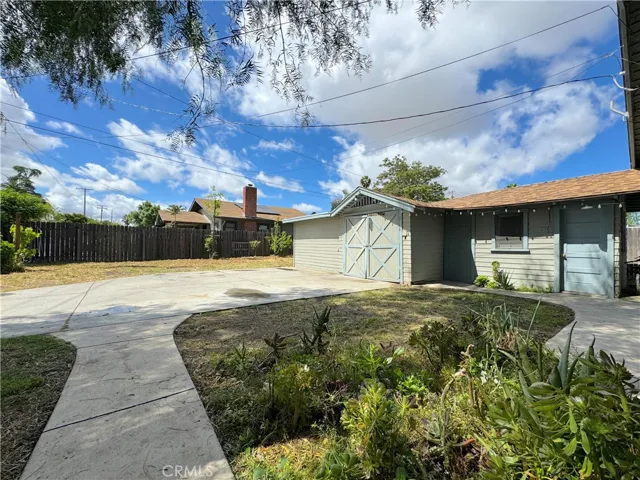 Expansive Yard Enclosed With Wood Fencing
