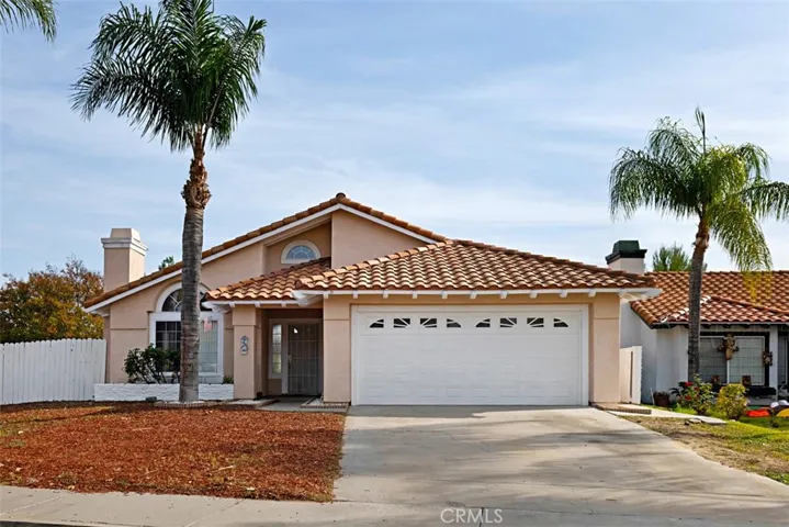 Corner lot with 2 car garage and driveway space.
