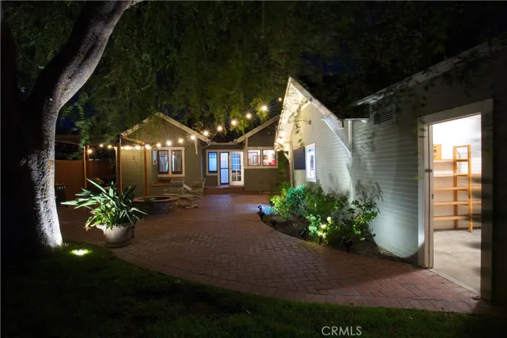 Back Patio with view of bonus room behind garage