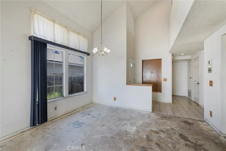 Dining room sits off the living room and has a large window with views of the back/side yard.