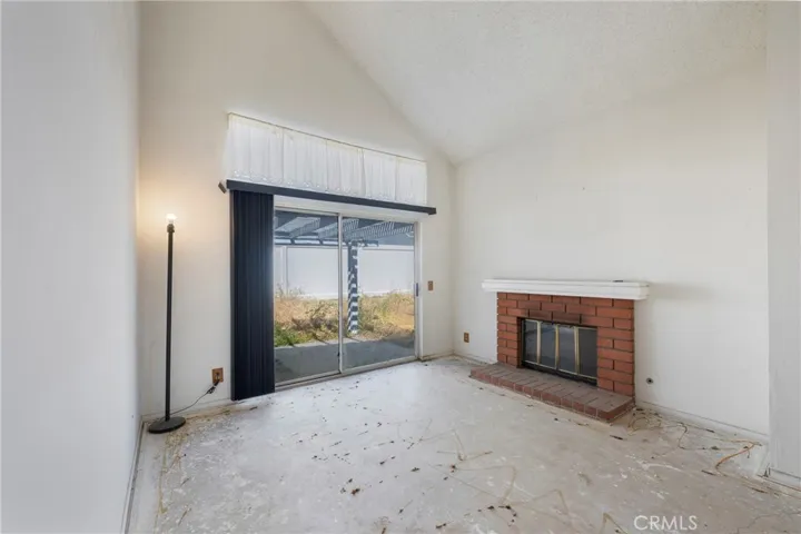 Gas fireplace with brick surround and hearth.