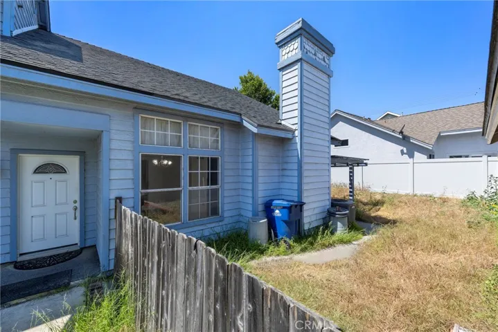 Views of the backyard area from the front yard...this home is on a zero lot line property!