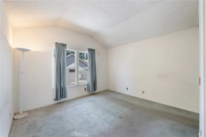 Primary bedroom with vaulted ceilings!