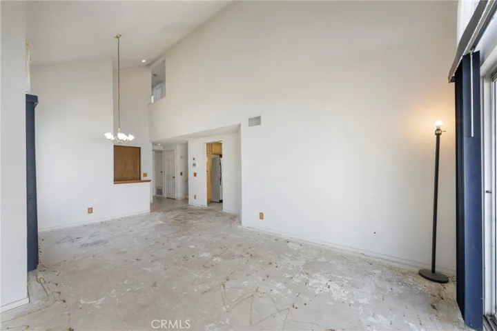 Living and dining room with vaulted ceilings.