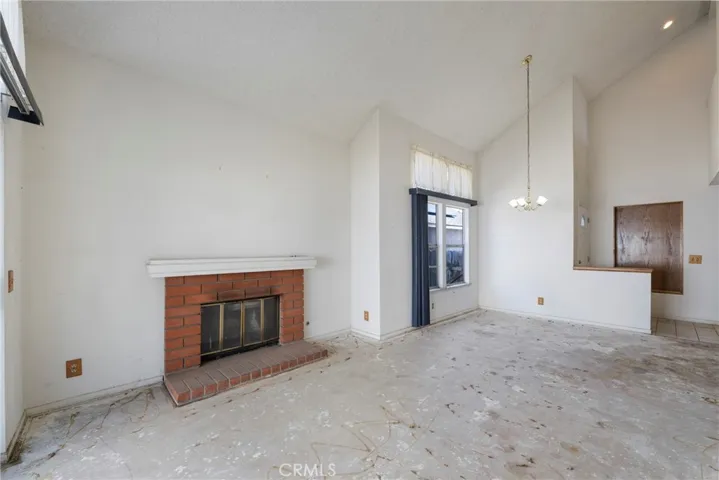 Views of living and dining rooms. Flooring for this entire area is currently the concrete slab.