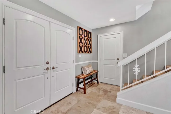 Double Entry Doors, Travertine Foyer, Staircase to Upstairs 3 Bedrooms and Bath