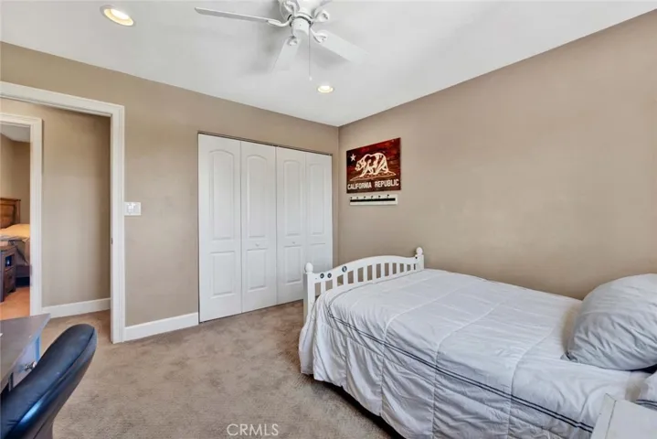 Bedroom #4 Upstairs with Recessed Lighting, Ceiling Fan, and Custom Organized Closet