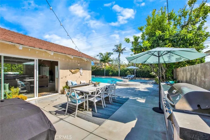 Resort-Style Backyard with Built-In BBQ Center and Multiple Patio Areas