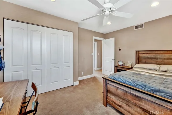 Bedroom #3 Upstairs has Recessed Lighting, Ceiling Fan, and Custom Organized Closet