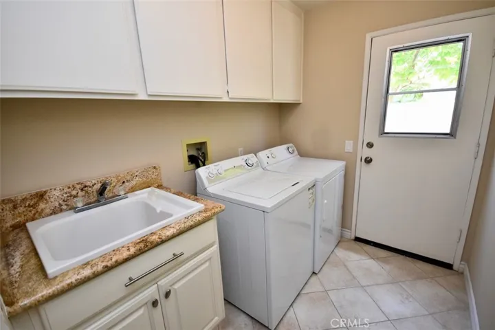Inside laundry room with sink!
