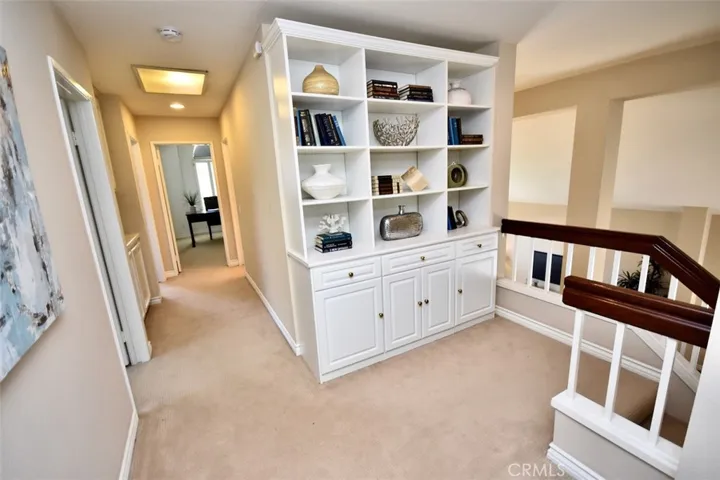 Custom Built-In Library & Cabinetry in Hallway.