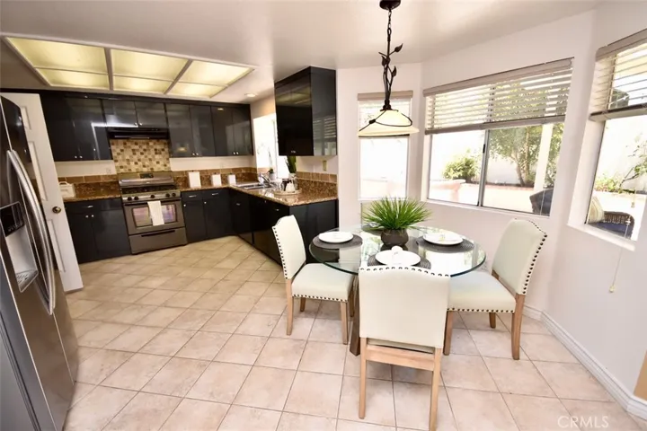 Breakfast Nook in Kitchen with Backyard View.
