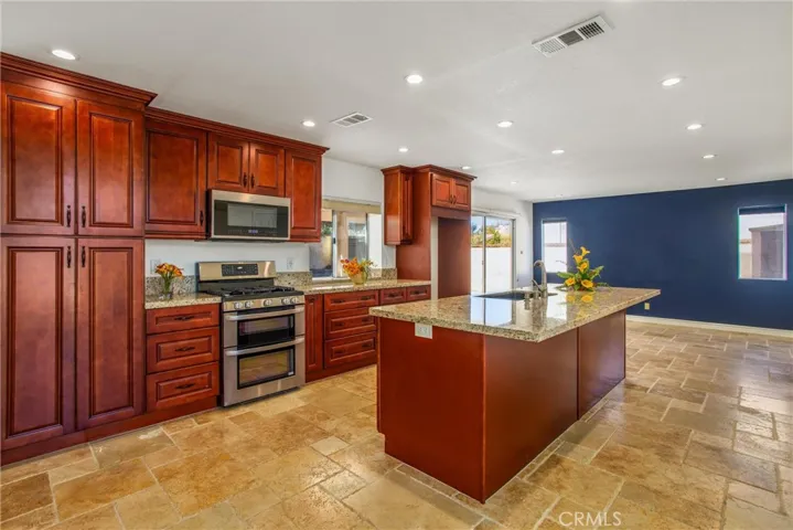 Kitchen with island, 
cabinetry