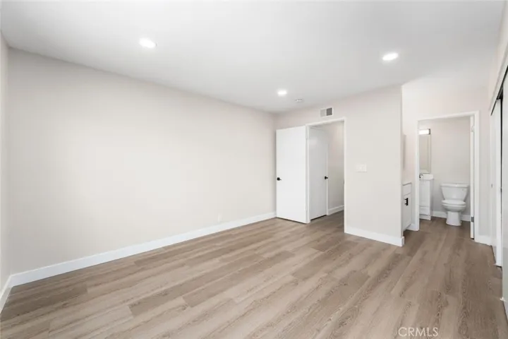 Primary bedroom showing direct access to main bathroom