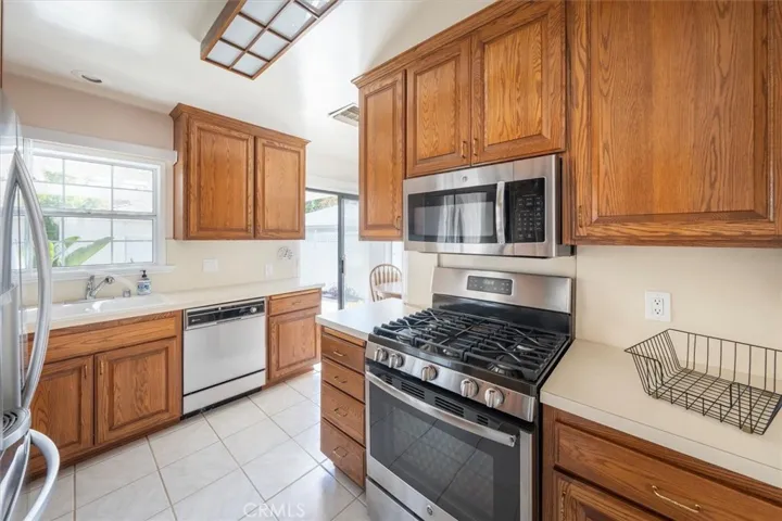 Upgraded kitchen with newer appliances.