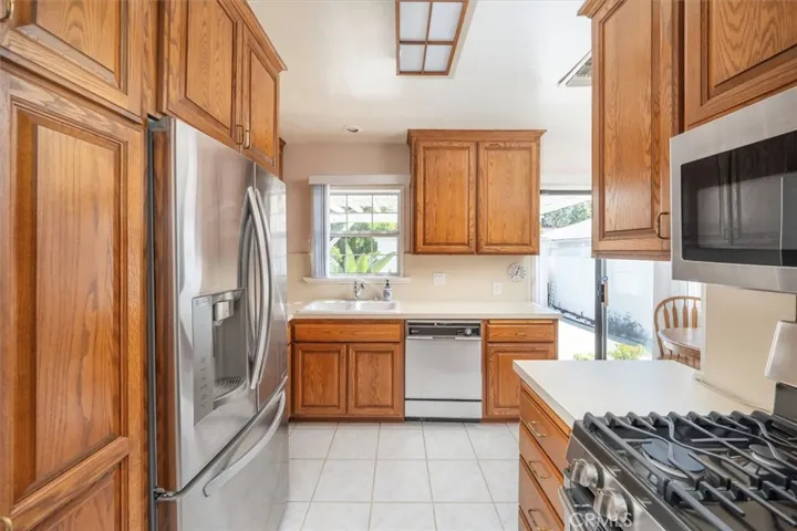 Upgraded kitchen with newer appliances.