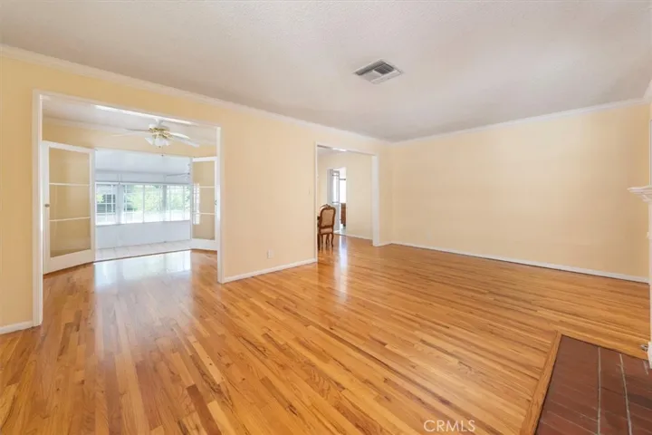 Living room opens to Den and Dining Room.