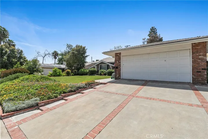 2 Car Garage with Opener. Driveway with Brick Ribbon, Low Step Walkway side of Drive