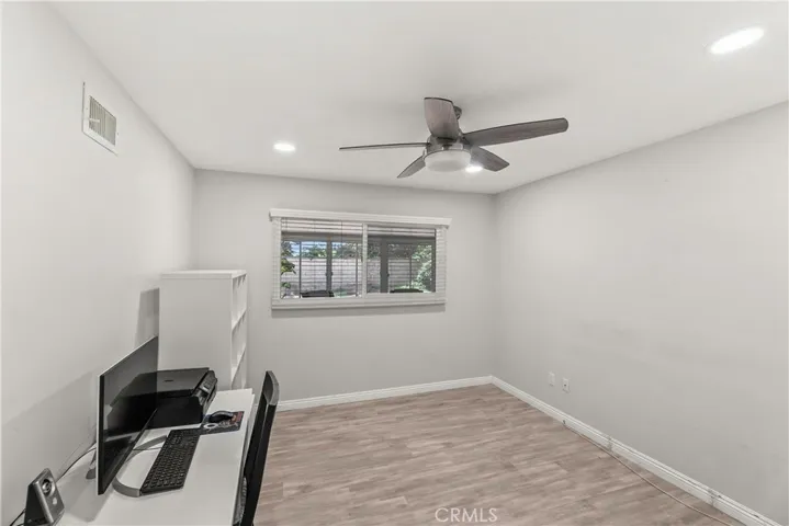 1st room on Right down hallway, Can Lights, Ceiling Fan, Laminate wood type flooring
